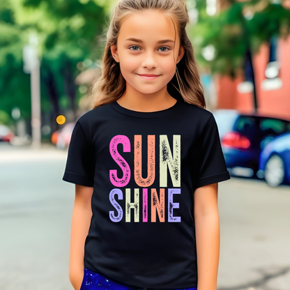 Girl on sidewalk in black “Sunshine” graphic shirt