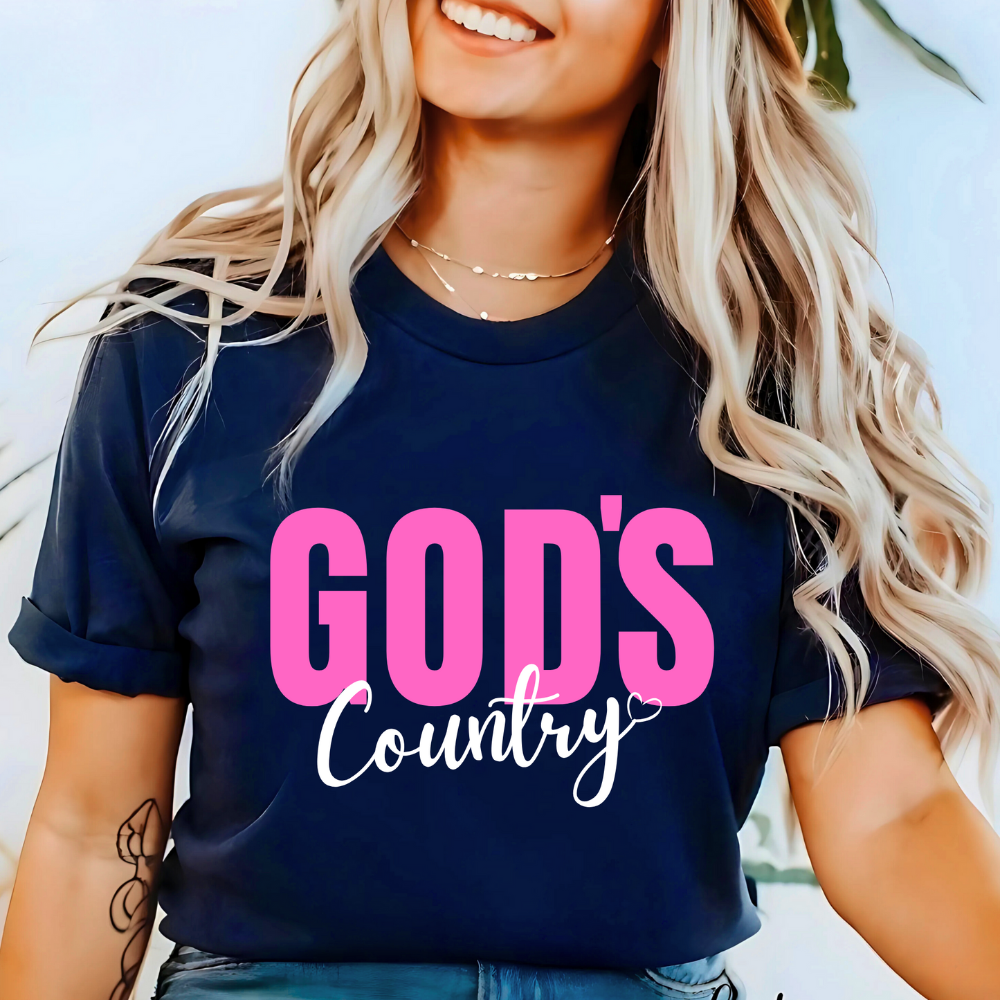 Navy God's Country Christian T-shirt with pink and white text, perfect for patriotic believers who love faith-based apparel