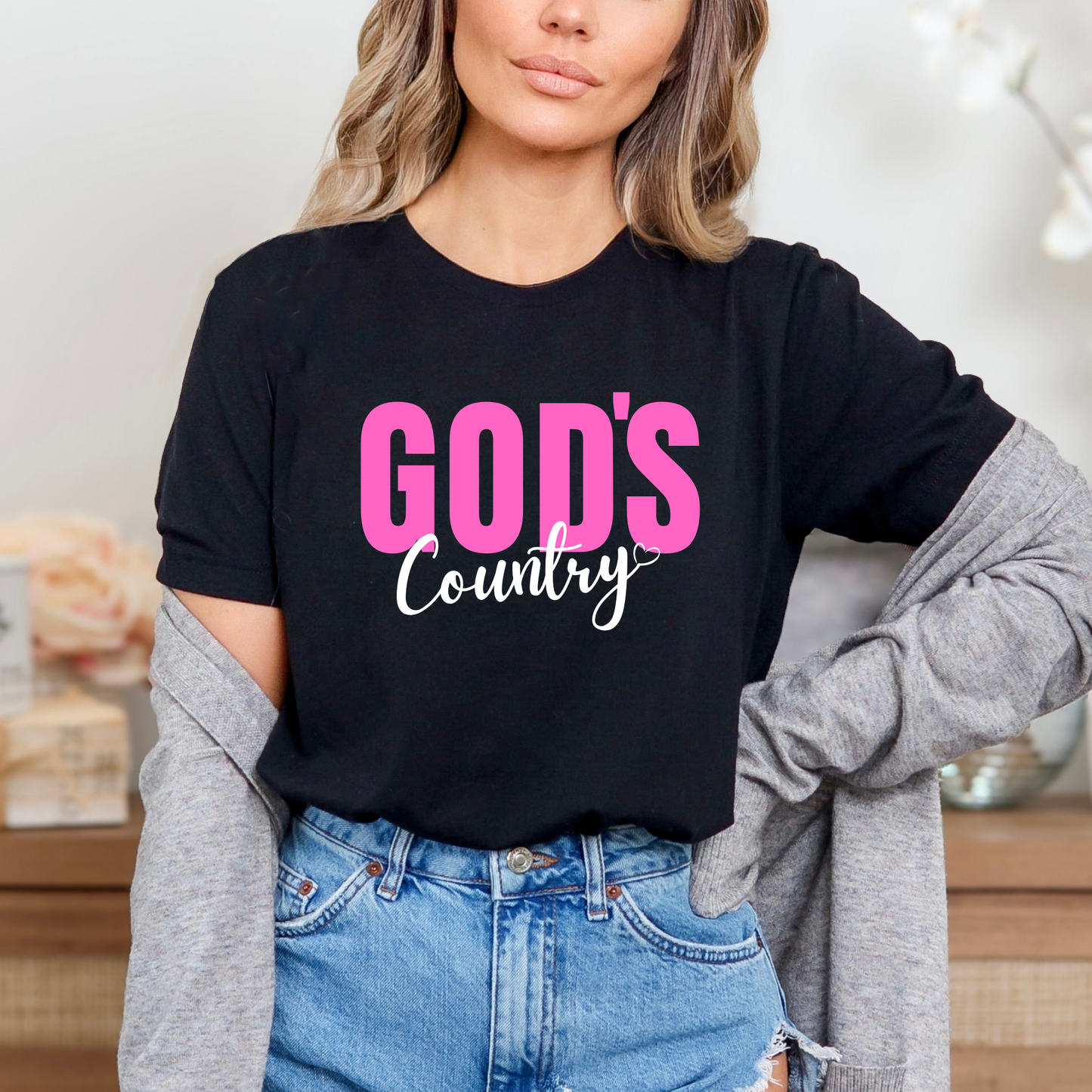Black God's Country Christian T-shirt with pink and white text, perfect for patriotic believers who love faith-based apparel