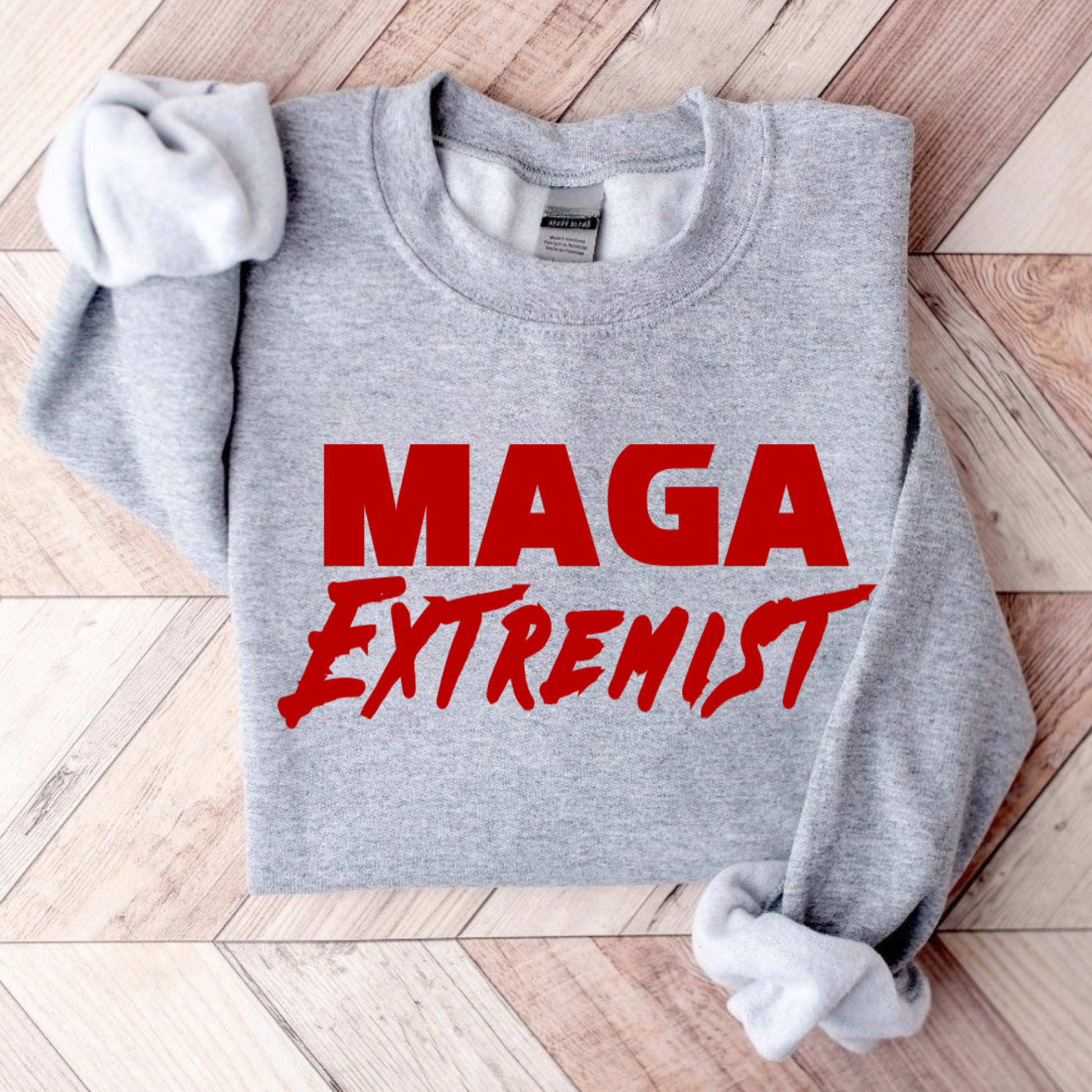 Folded sports gray MAGA Extremist sweatshirt flat lay