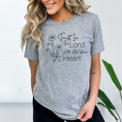 White women’s faith tee with scripture-inspired design “Trust in the Lord With All Your Heart”