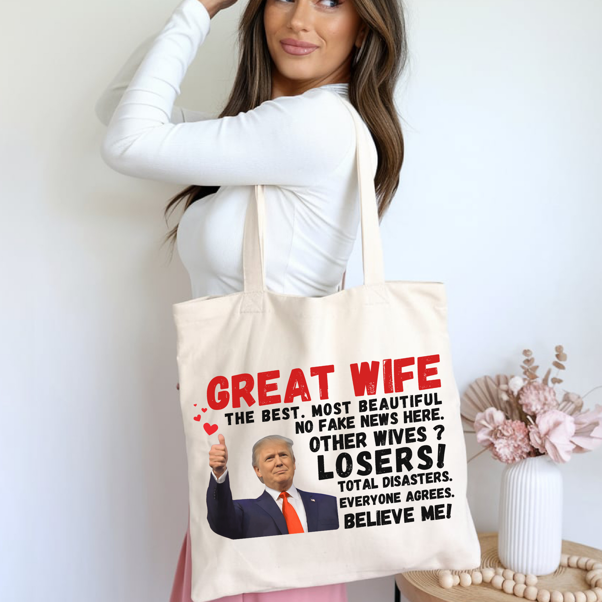 Woman holding Great Wife funny tote bag with Trump Image
