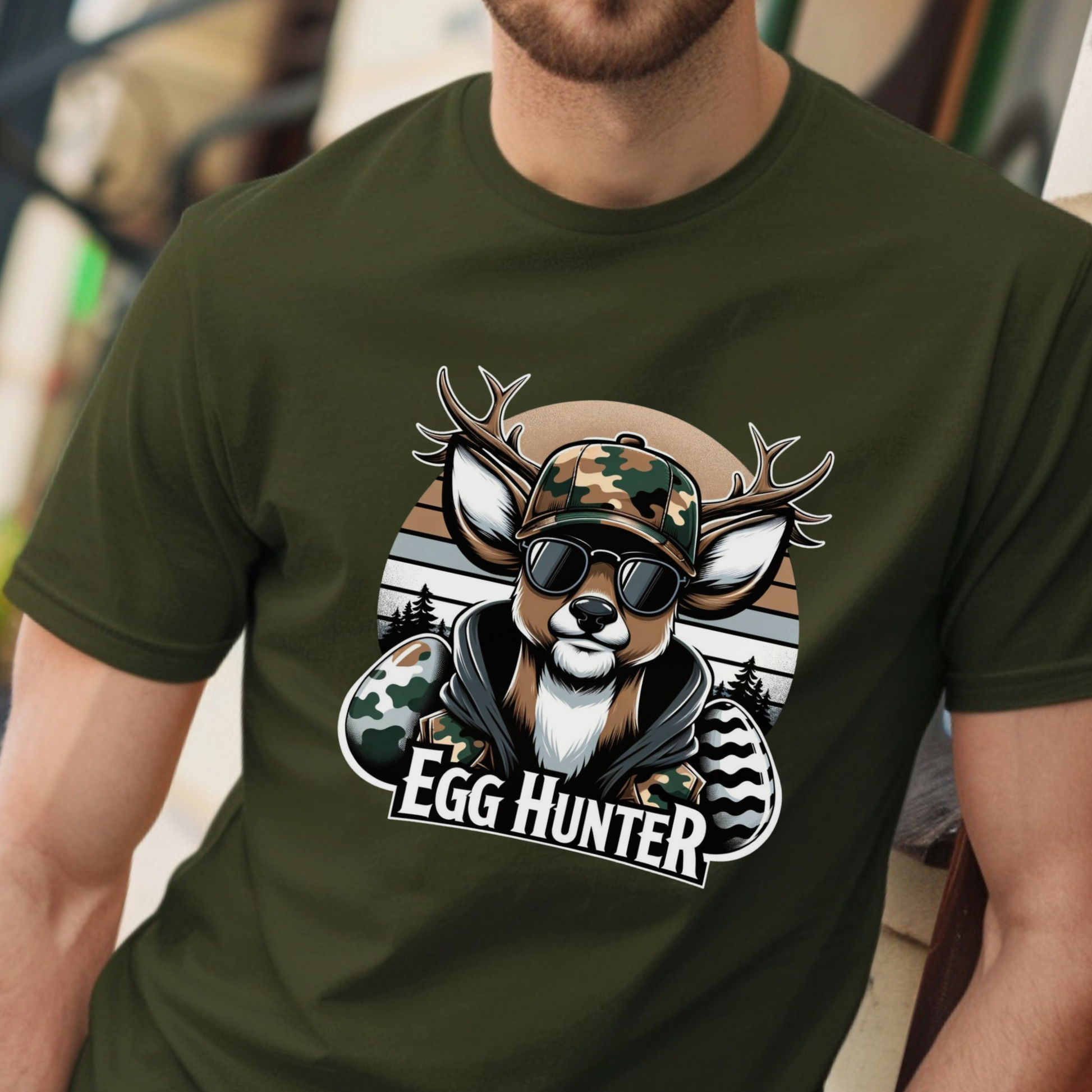  Military-green Egg-Hunter-Shirt featuring a camo deer with sunglasses and Easter eggs, perfect for hunters, veterans, and outdoor enthusiasts