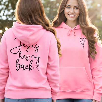 Two pink hoodies, one with text on the back and the other plain, worn by two people outdoors.