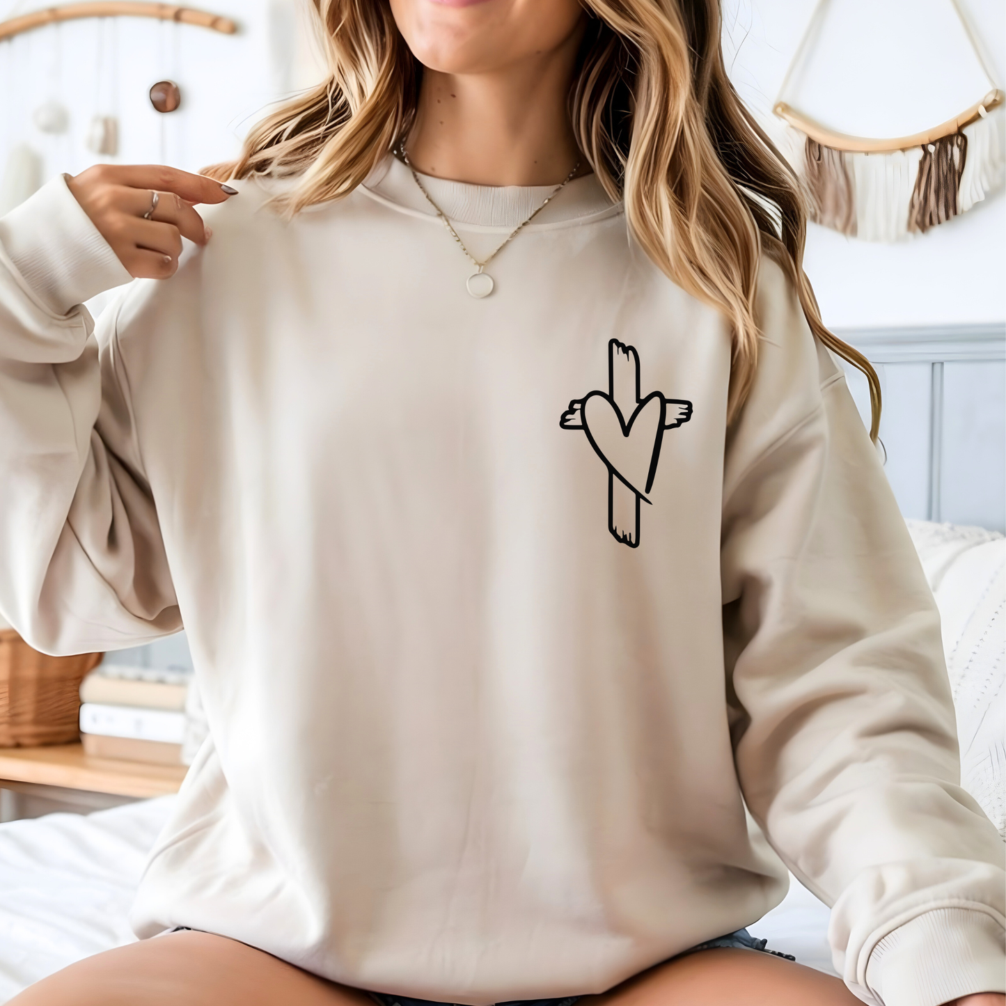 Cream Christian sweatshirt with small cross heart design on front chest, cozy unisex fit