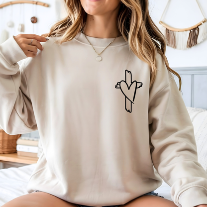 Cream Christian sweatshirt with small cross heart design on front chest, cozy unisex fit