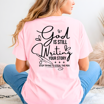Person wearing a pink t-shirt with a motivational quote on the back.