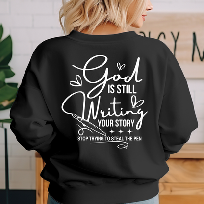 Black Christian sweatshirt back view with God Is Still Writing Your Story religious quote