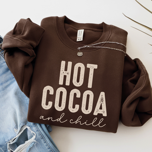 Hot Cocoa and Chill sweatshirt in brown – flat lay with necklace and ripped jeans
