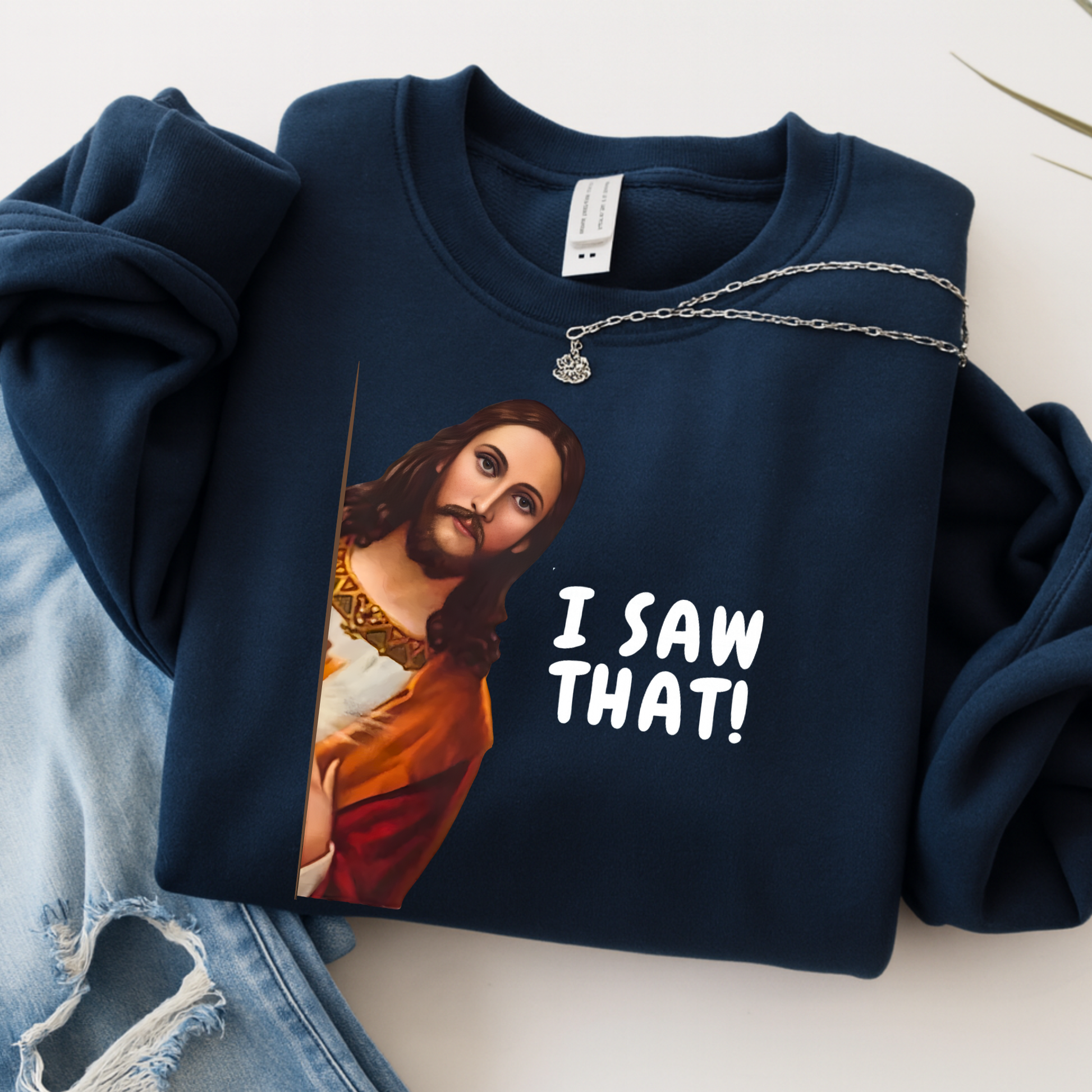 Navy blue sweatshirt with a graphic of a historical figure and 'I Saw That!' text, displayed on a light surface.