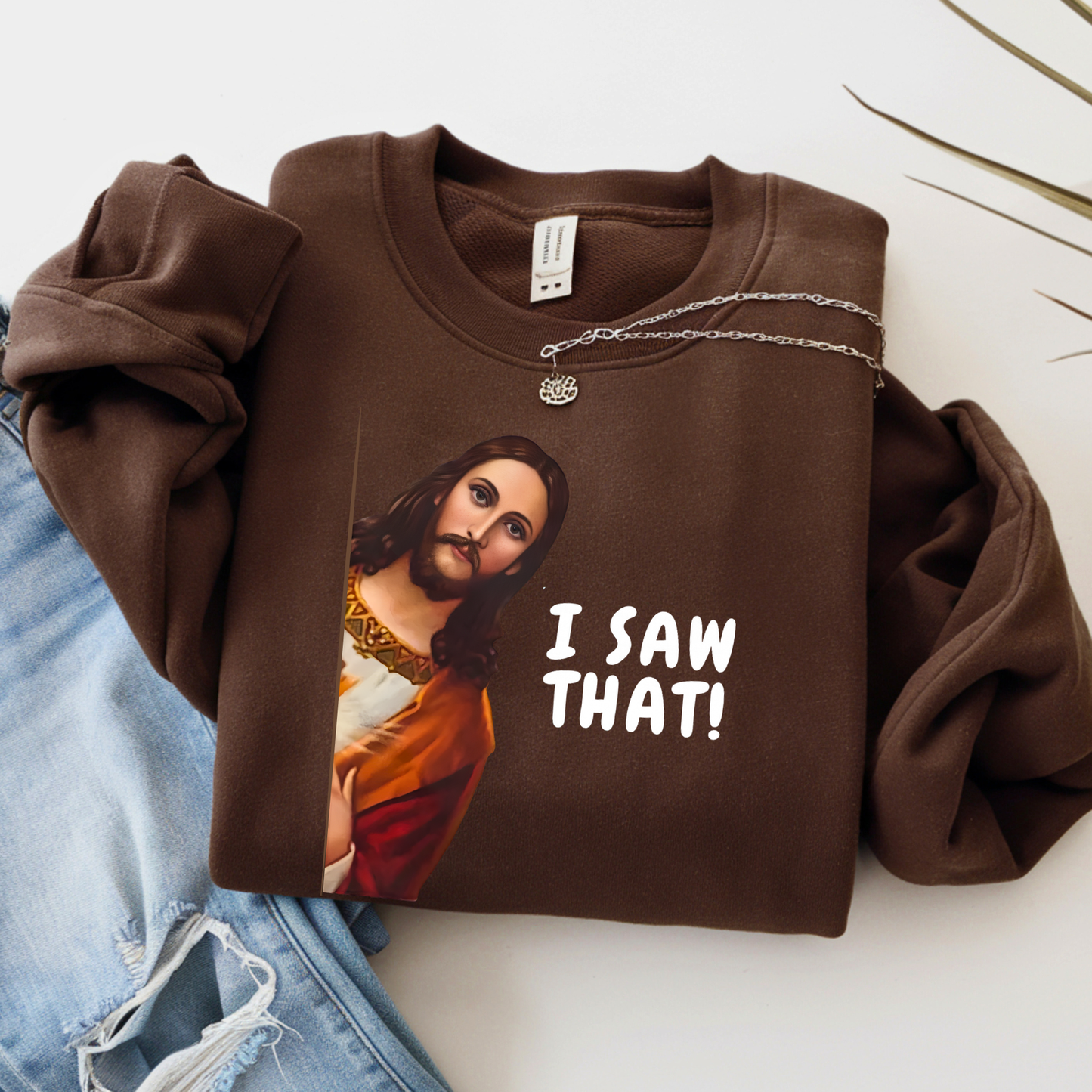 I Saw That funny Jesus graphic sweatshirt in brown flat lay
