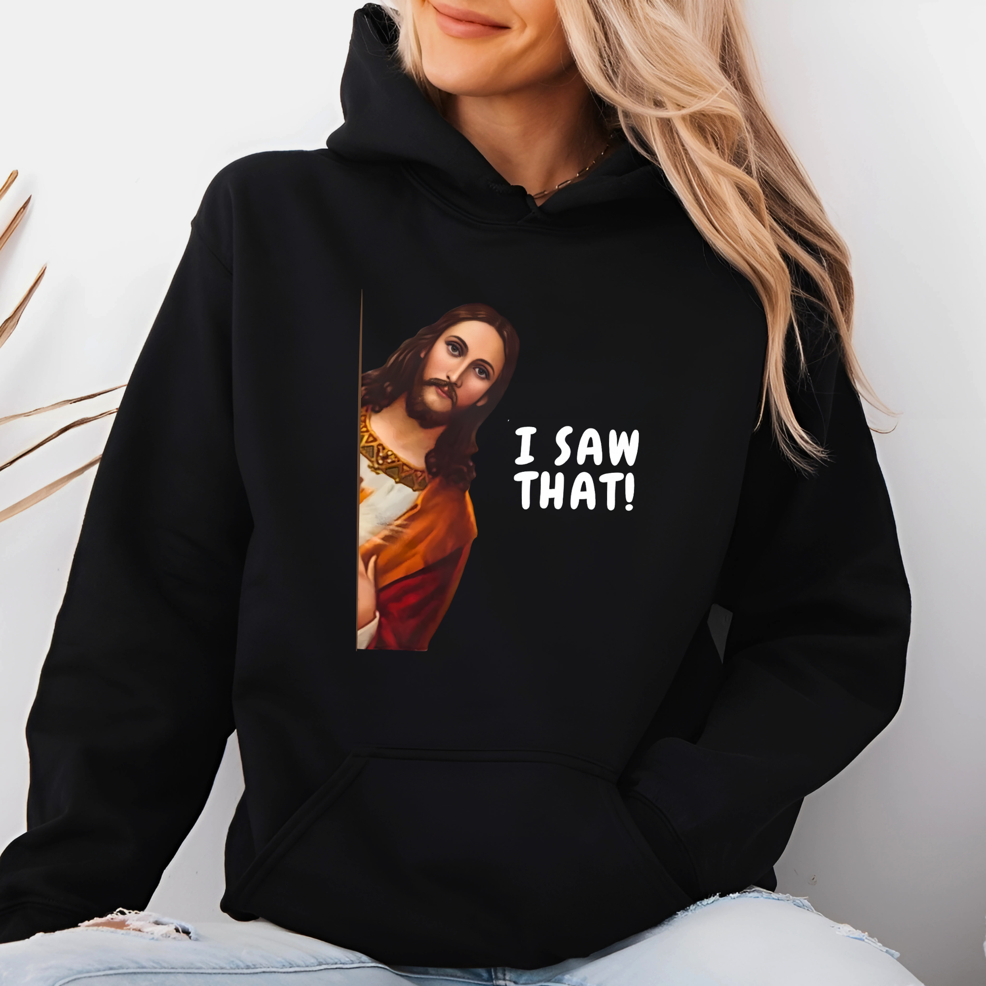 Woman wearing I Saw That funny Jesus graphic hoodie
