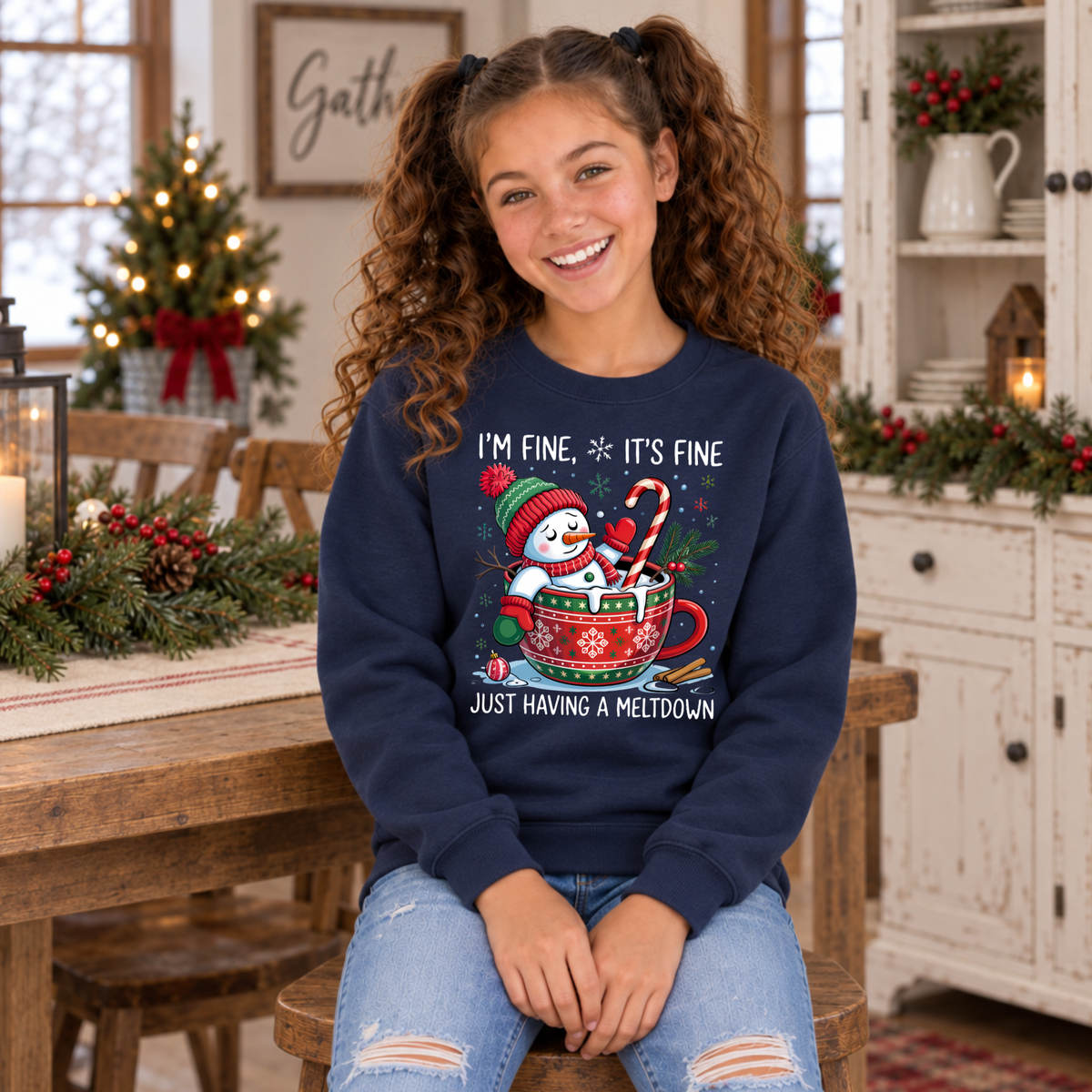 Girl wearing a navy youth sweatshirt with the I'm Fine It's Fine snowman meltdown Christmas design