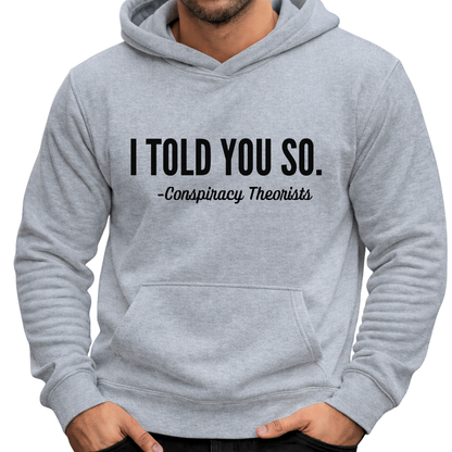 Man wearing gray pullover hoodie with “I Told You So – Conspiracy Theorists” text design