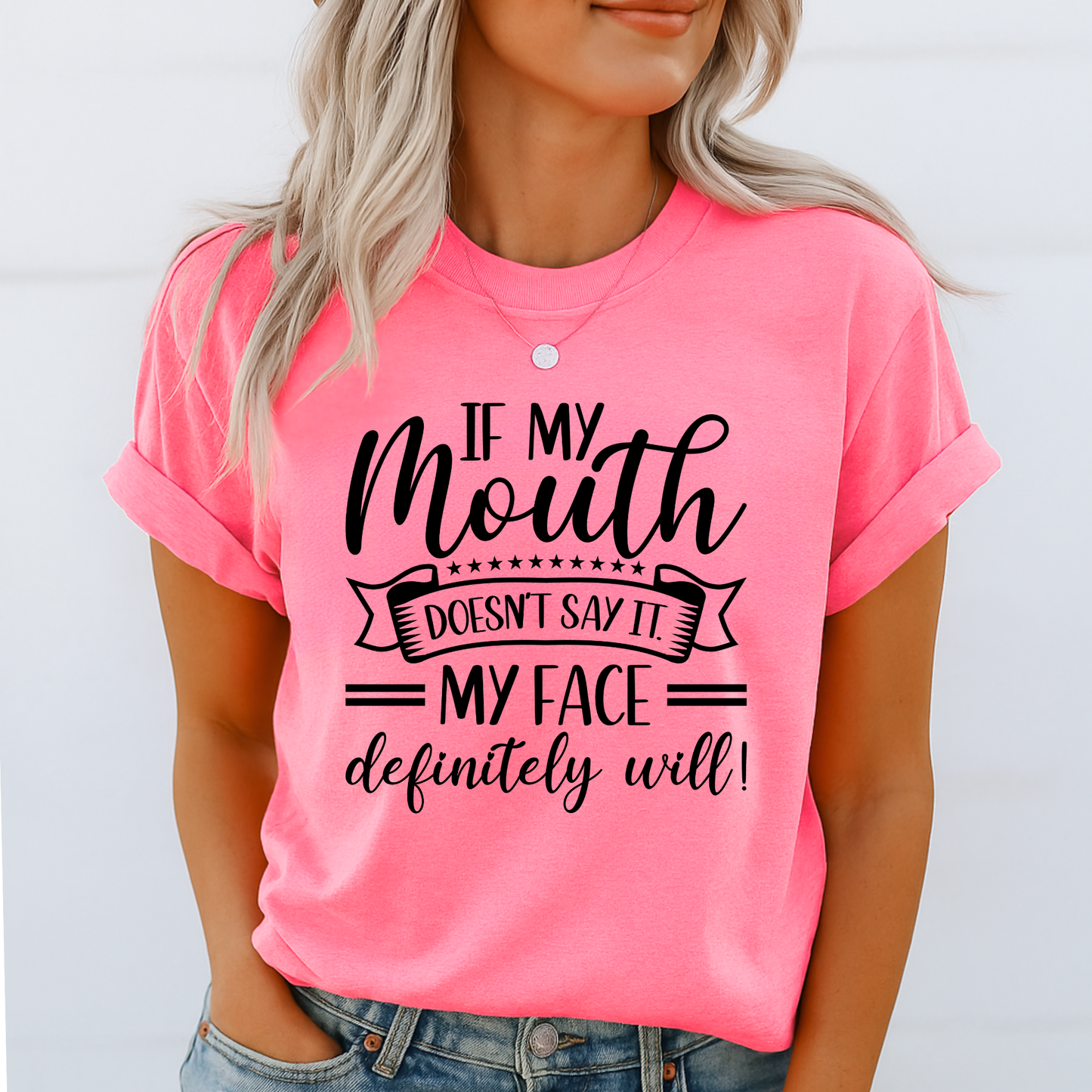Bright pink graphic shirt on woman with hand in pocket