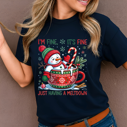 Woman in navy blue holiday tee with snowman in cocoa mug Christmas design.