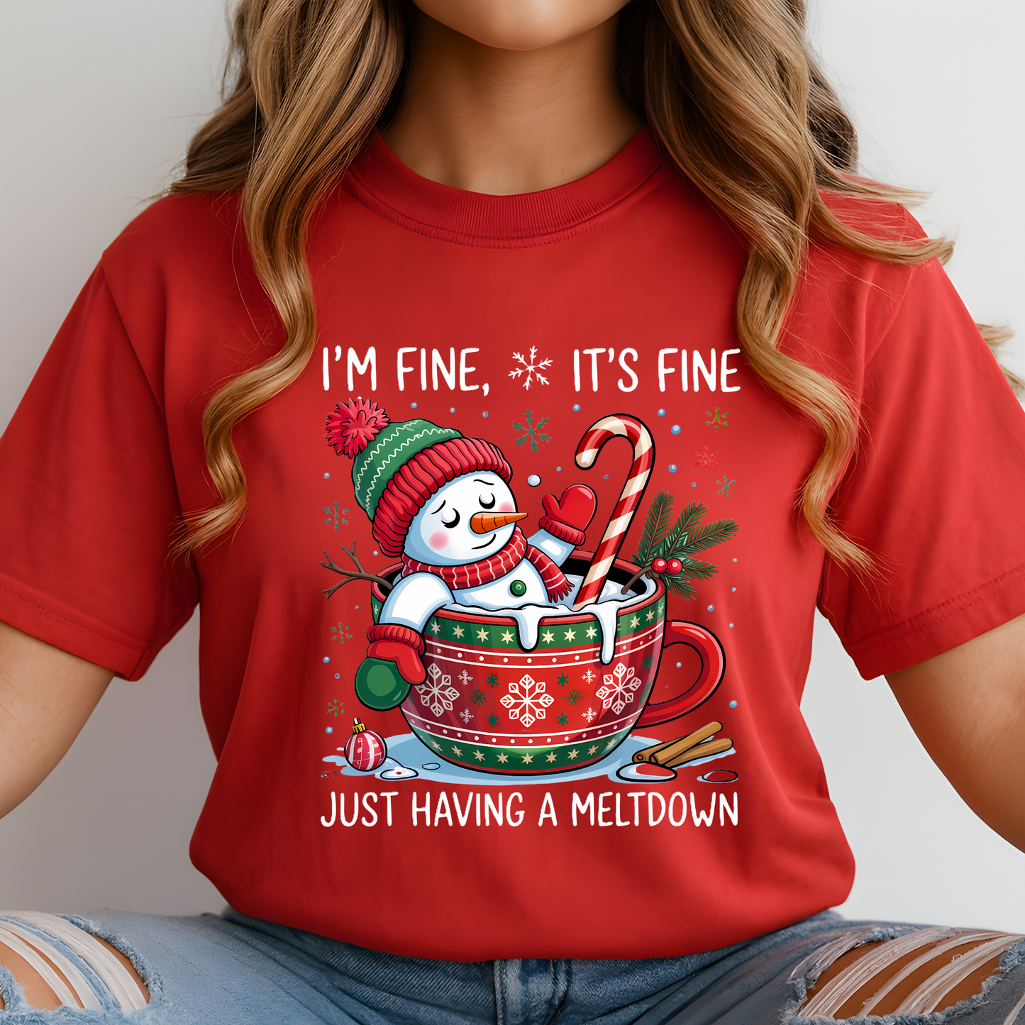 Woman in red Christmas shirt featuring funny melting snowman design.