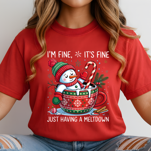 Woman in red Christmas shirt featuring funny melting snowman design.
