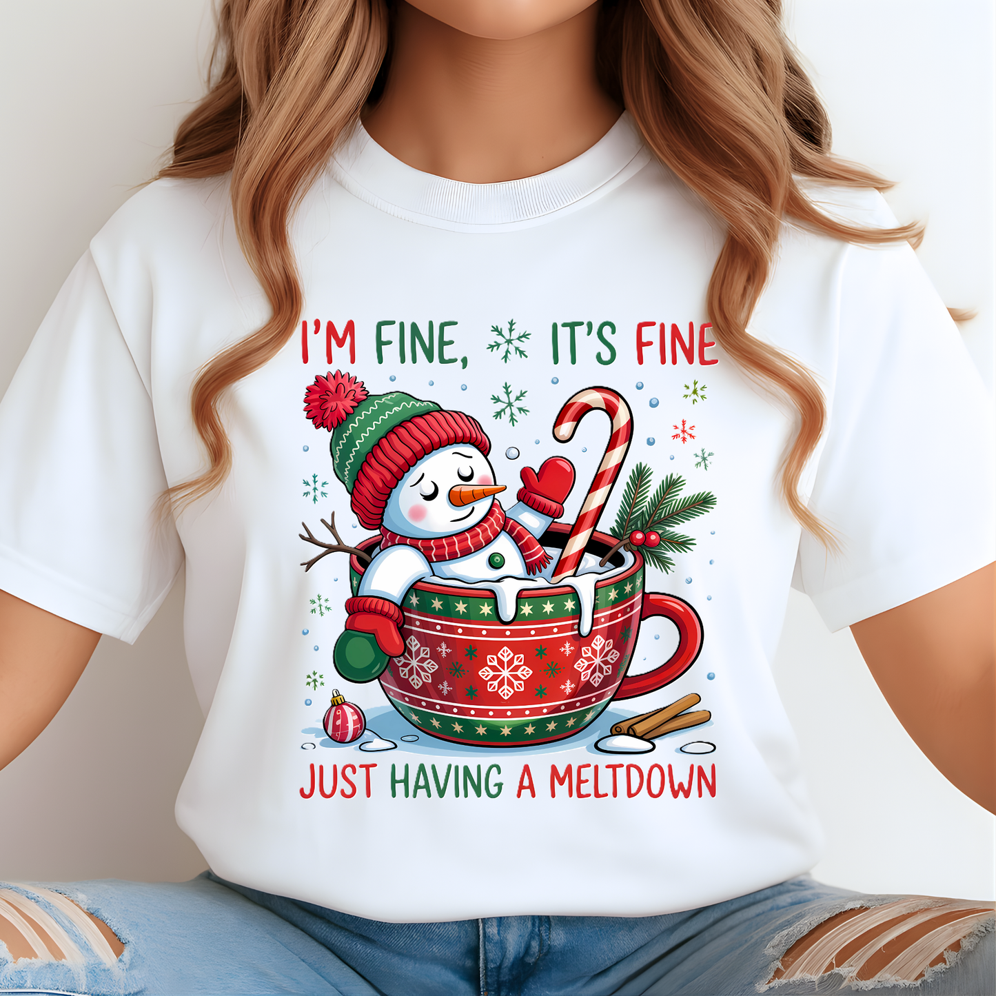 Woman in white Christmas shirt with “I’m Fine It’s Fine Just Having a Meltdown” design.