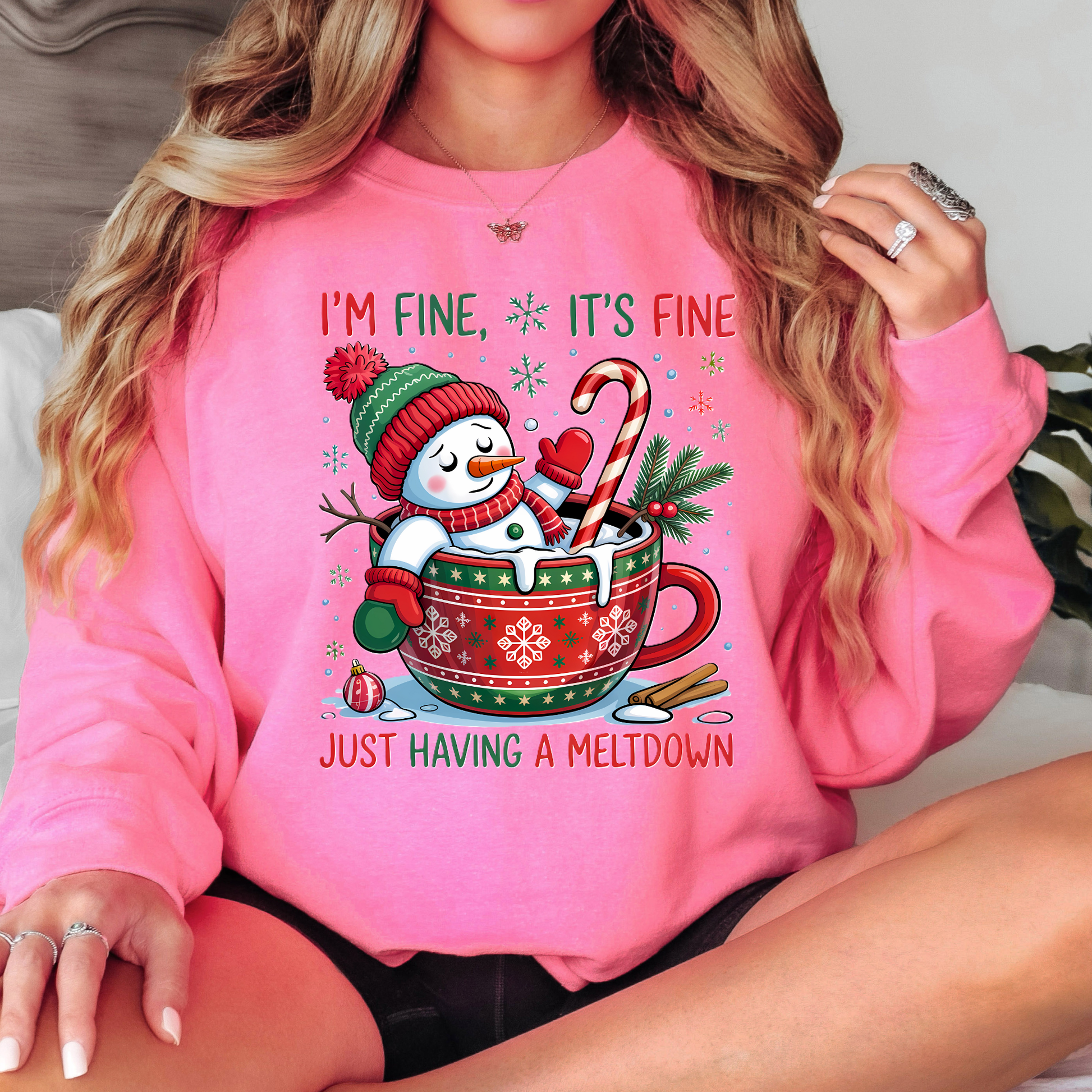 Bright pink sweatshirt with cute holiday snowman in mug design