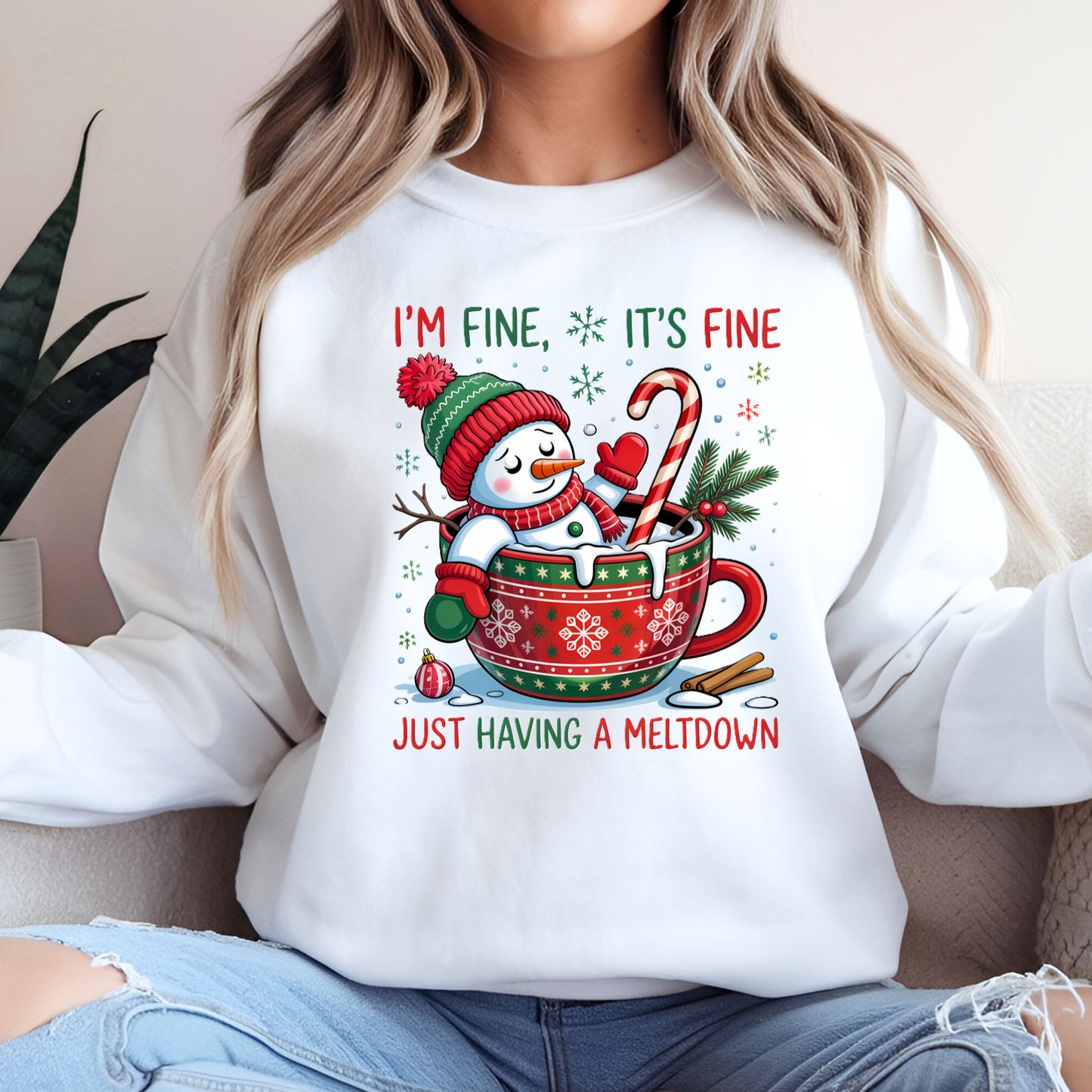 White sweatshirt with “I’m Fine, It’s Fine, Just Having a Meltdown” snowman design
