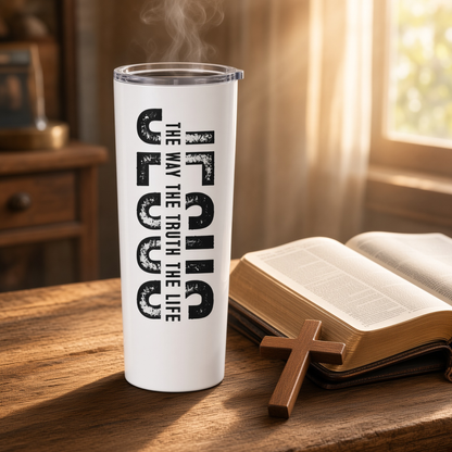 White 20 oz Jesus tumbler with ‘The Way The Truth The Life’ design beside an open Bible and wooden cross.