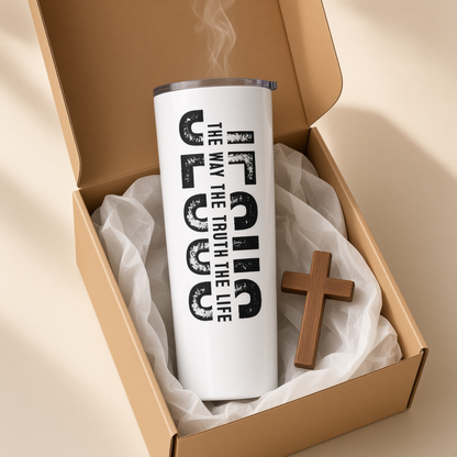 White 20 oz Jesus tumbler with ‘The Way The Truth The Life’ design displayed inside an open gift box beside a wooden cross.
