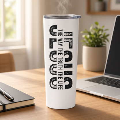 White 20 oz Jesus tumbler with ‘The Way The Truth The Life’ design on a desk beside a laptop and notebook.