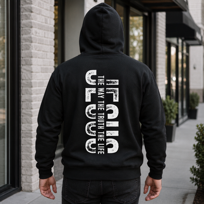 Person shown from behind wearing a black hoodie with vertical white JESUS lettering and “The Way, The Truth, The Life” text.
