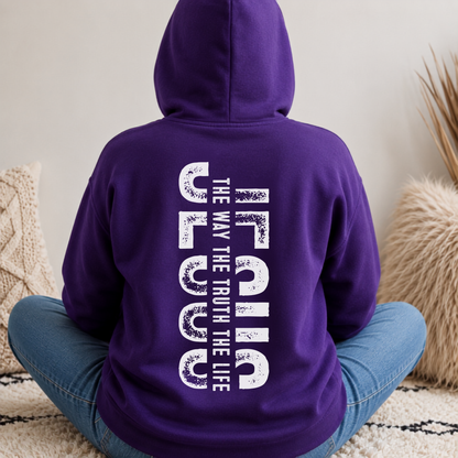 Person shown from behind wearing a purple hoodie with vertical white JESUS lettering and “The Way, The Truth, The Life” text.