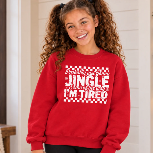 Girl wearing a red youth sweatshirt with white Probably Just Gonna Jingle Some of the Way I'm Tired Christmas design