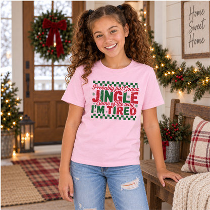 Girl wearing a light pink youth T-shirt with red and green Probably Just Gonna Jingle Some of the Way I'm Tired Christmas design
