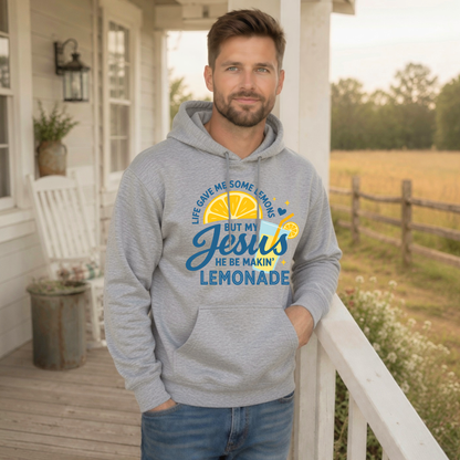 Man wearing a sports gray hoodie with the Life Gave Me Some Lemons, But My Jesus He Be Makin’ Lemonade design on a country porch.