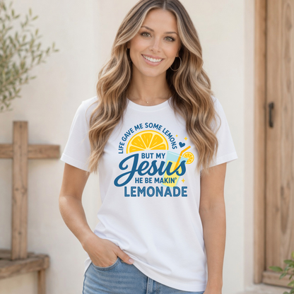 Woman in a white T-shirt displaying the Life Gave Me Some Lemons, But My Jesus He Be Makin’ Lemonade design against a clean neutral background.