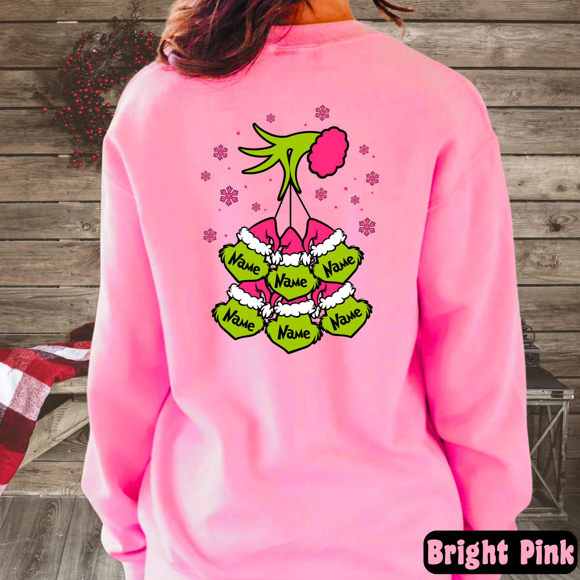 Bright pink sweatshirt with customizable ornament design on back

