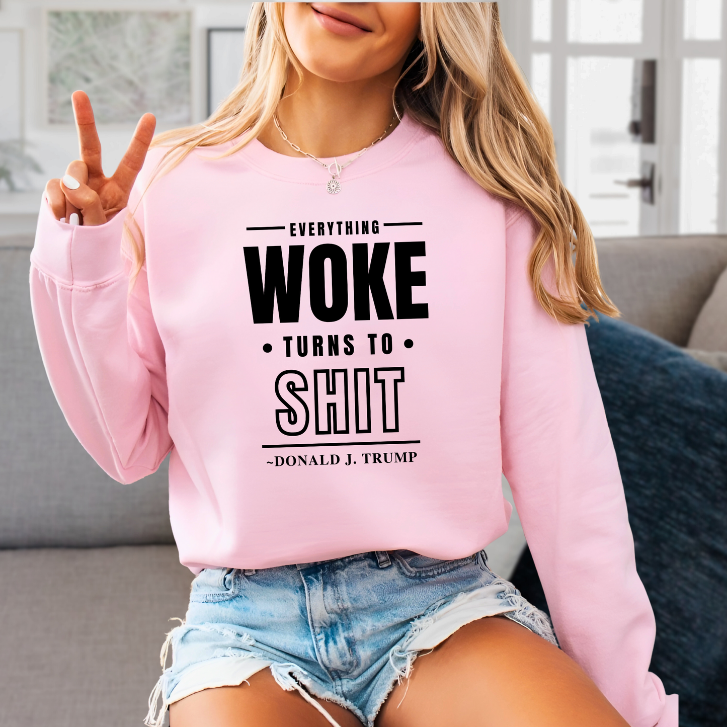 Light pink sweatshirt styled casually with black lettering