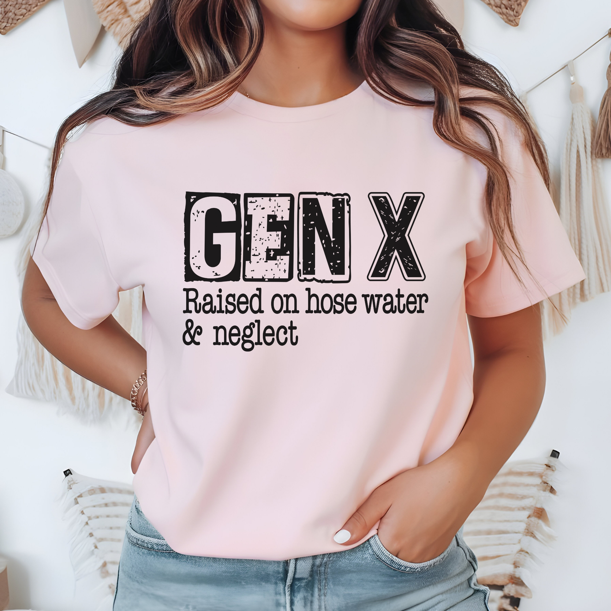 Light pink t-shirt with black GEN X text and humorous quote, styled casually