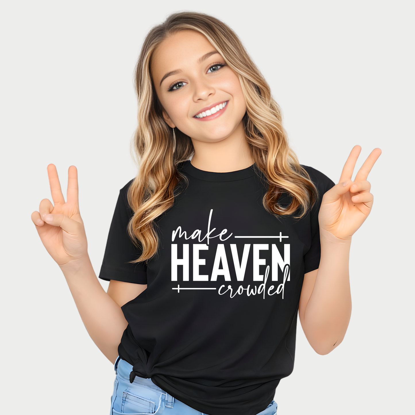 Smiling girl wearing black Make Heaven Crowded t-shirt with peace sign pose