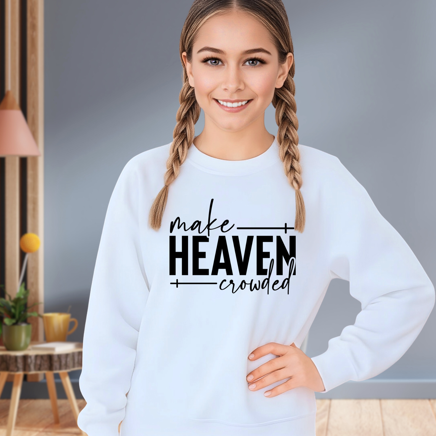Girl wearing light blue Make Heaven Crowded sweatshirt with hands on hips