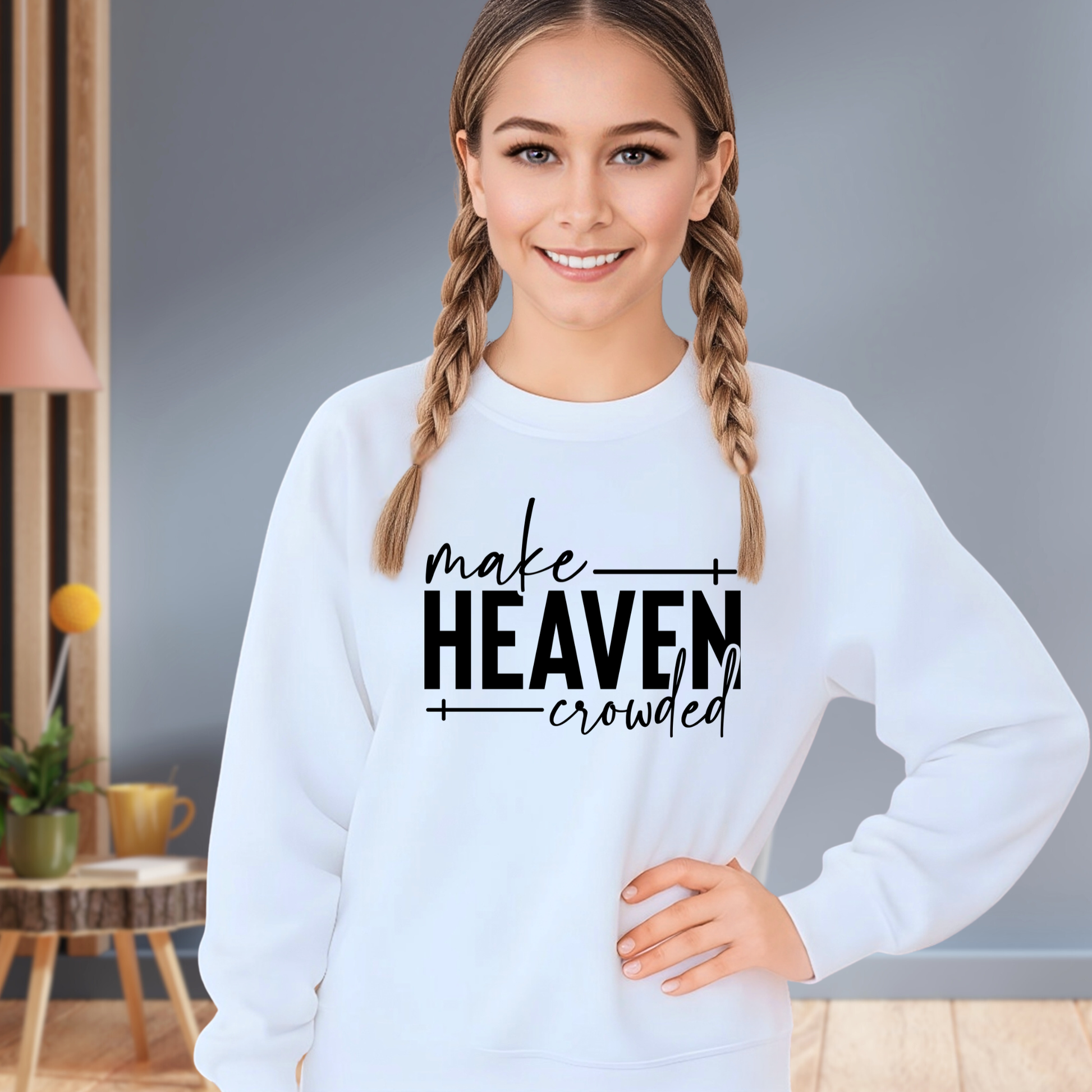 Girl wearing light blue Make Heaven Crowded sweatshirt with hands on hips