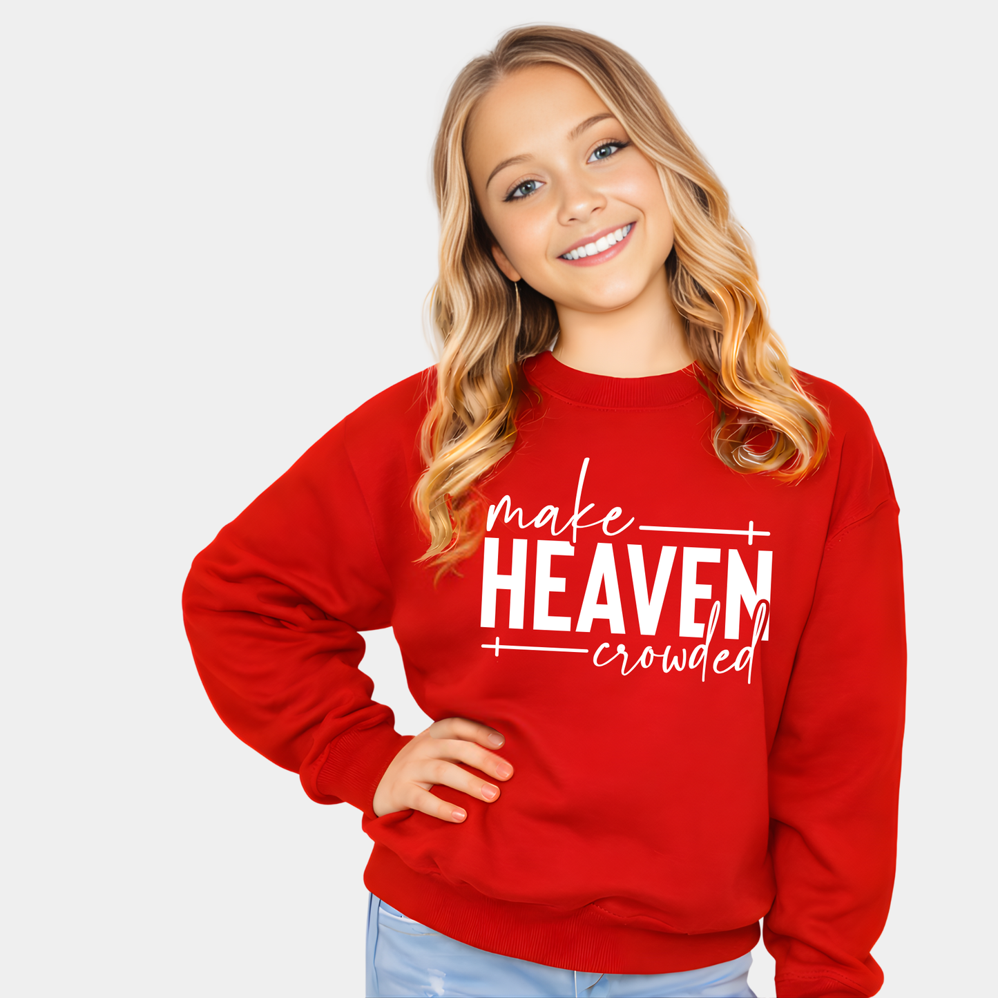 Girl wearing red Make Heaven Crowded sweatshirt smiling with hands on hips