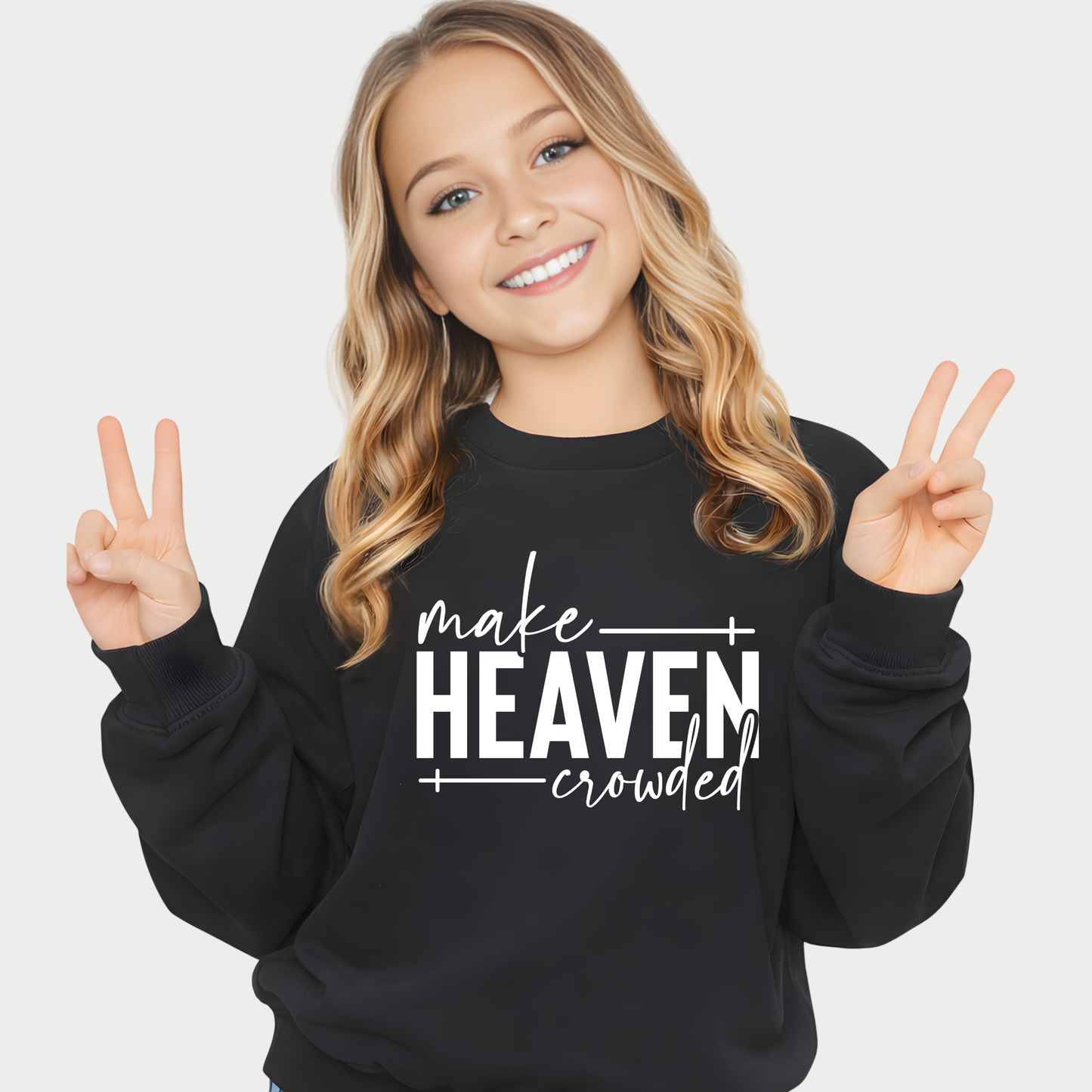Smiling girl wearing black Make Heaven Crowded t-shirt giving peace sign