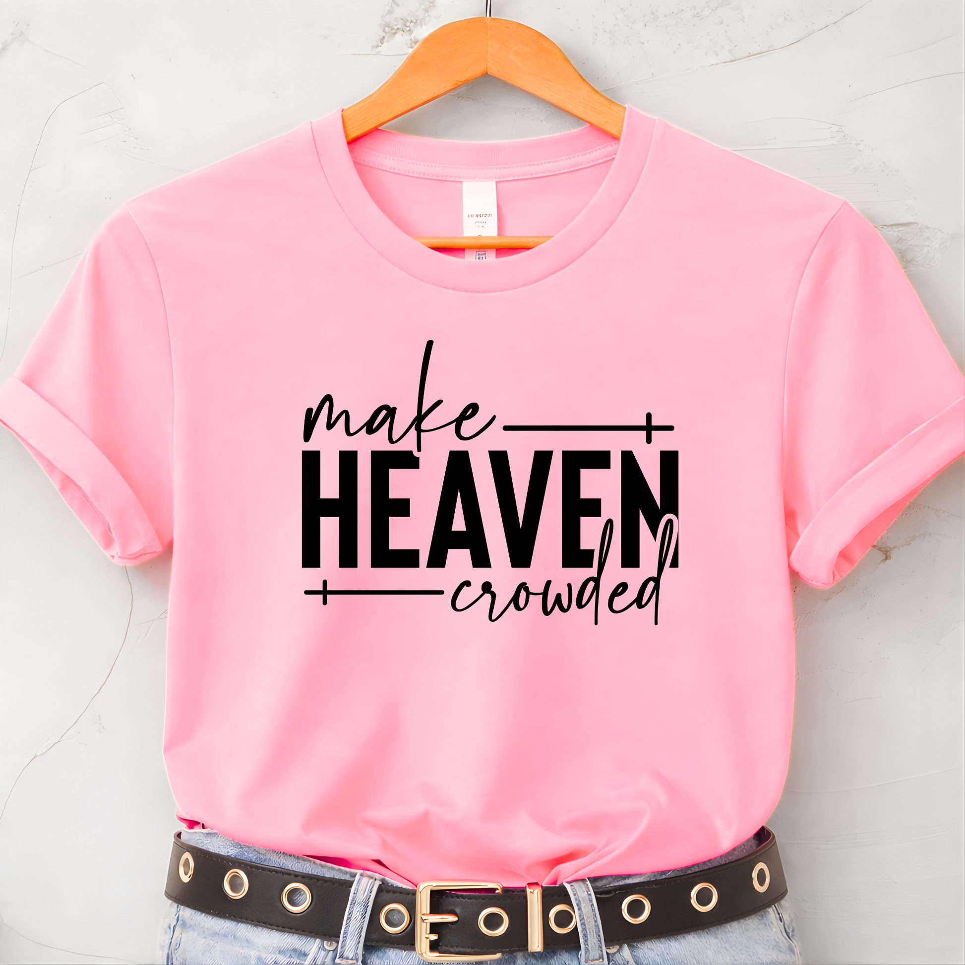 Make Heaven Crowded design on pink short sleeve shirt on hanger