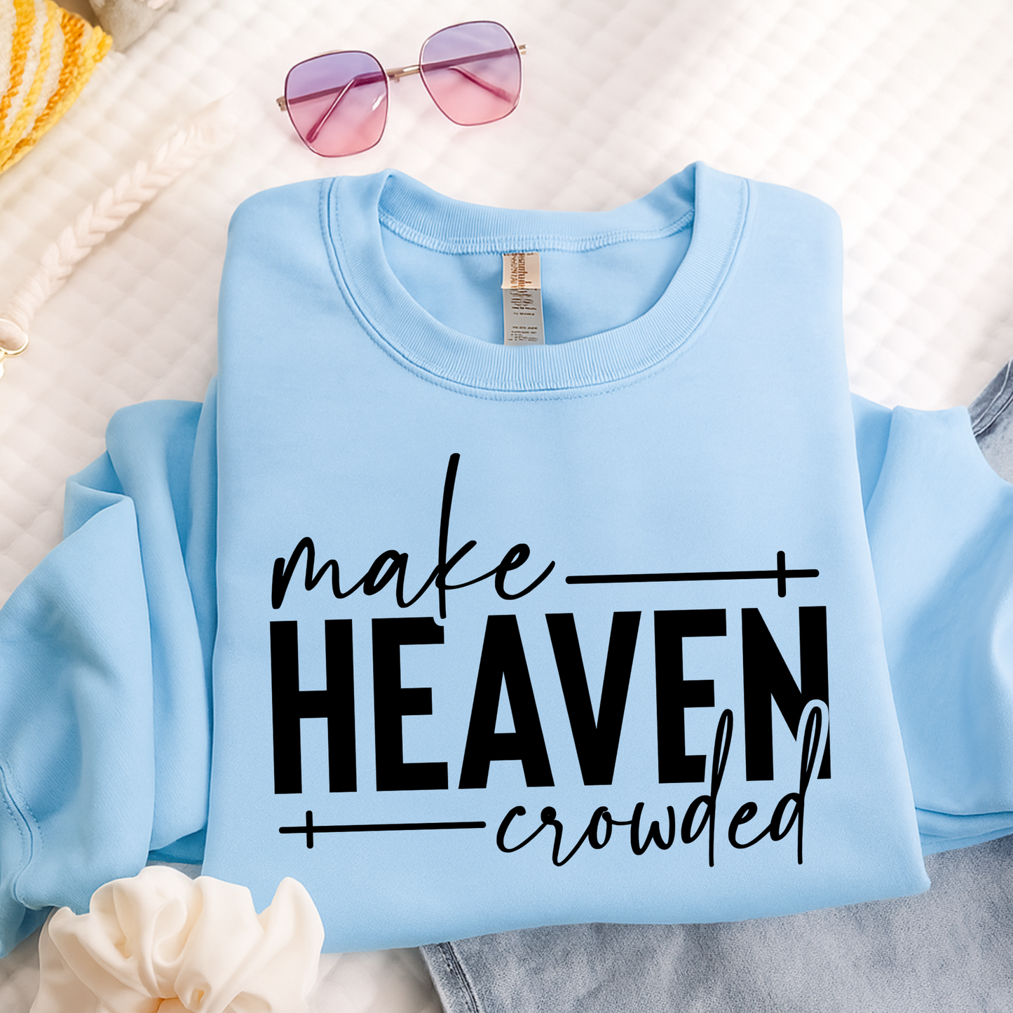 Make Heaven Crowded design on light blue sweatshirt flat lay
