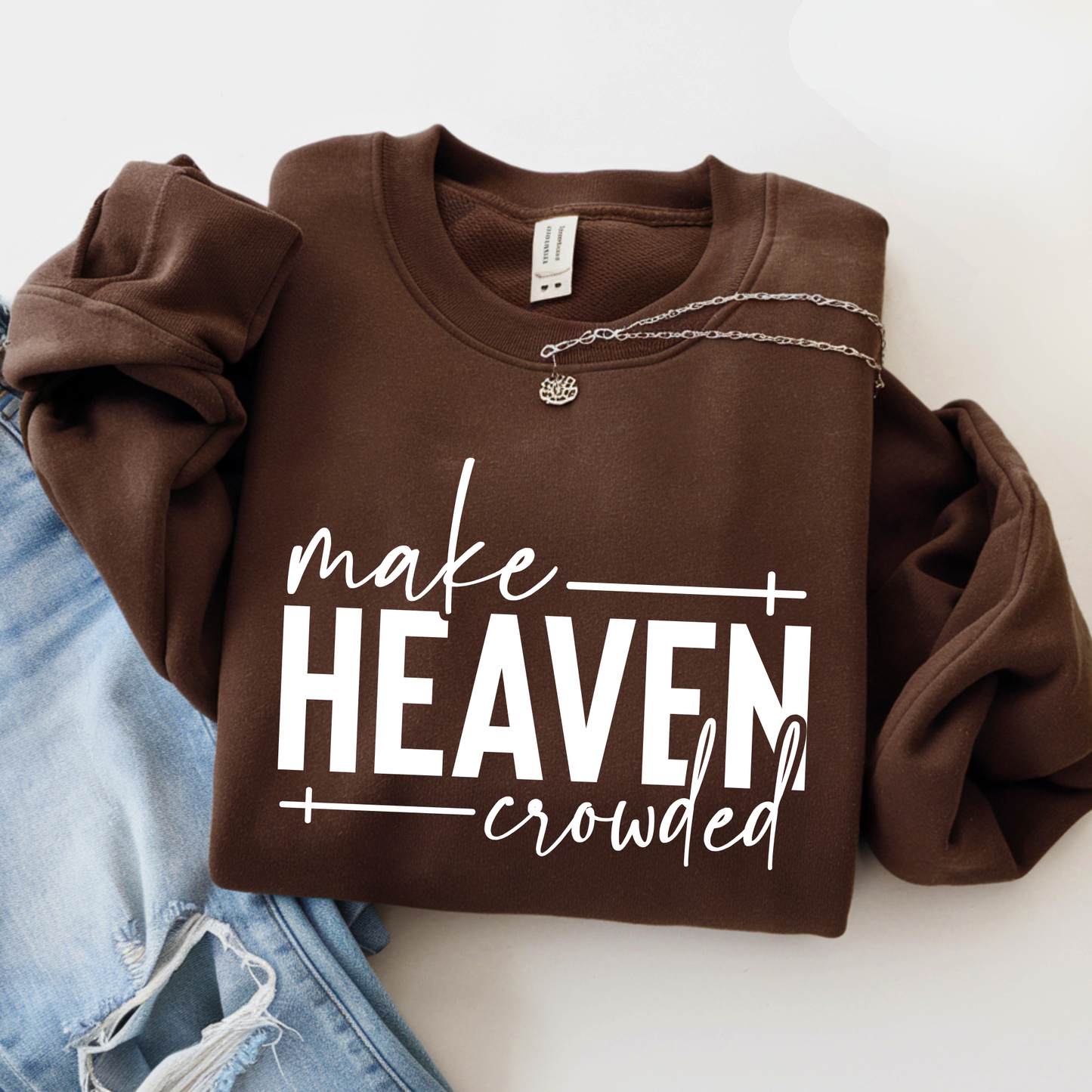 Make Heaven Crowded design on brown sweatshirt flat lay