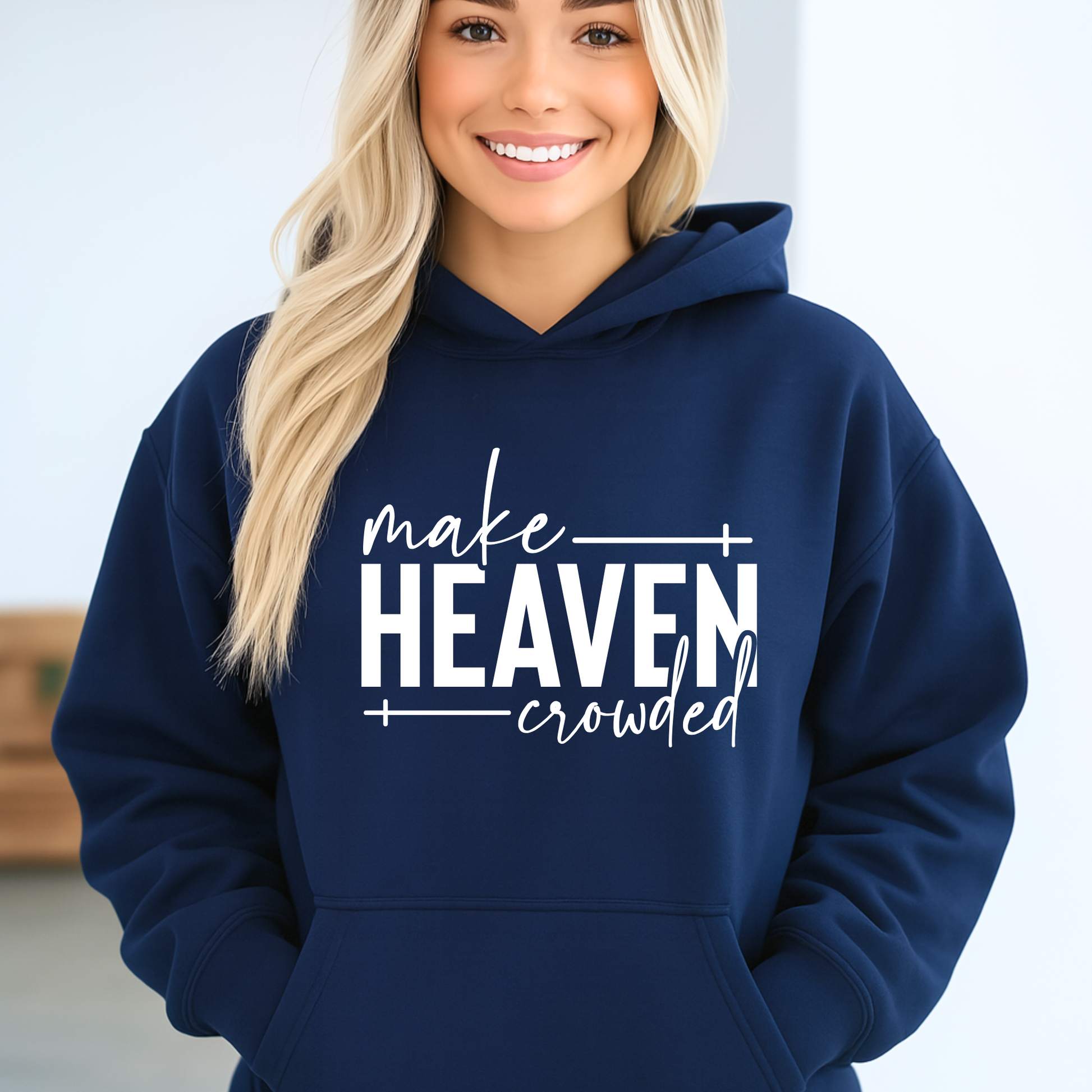 Make Heaven Crowded design on navy sweatshirt worn by woman