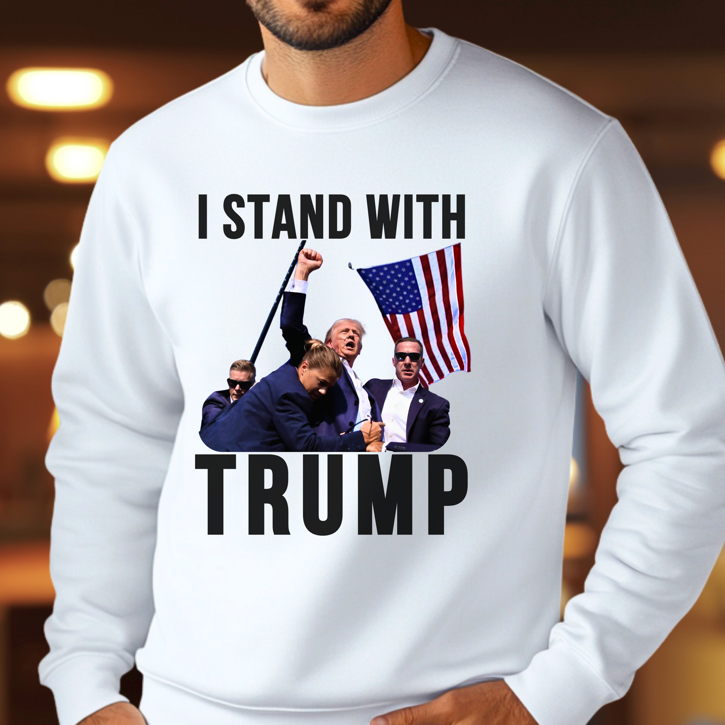 Man wearing “I Stand With Trump” white sweatshirt with bold flag and Trump scene – patriotic men’s pullover
