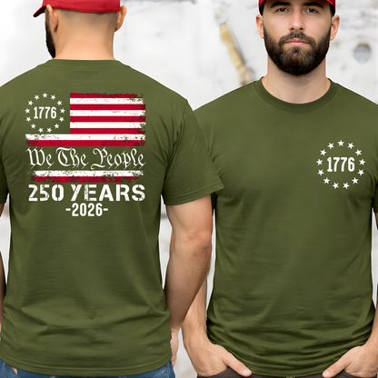 Man wearing a green t-shirt with American flag design and text on the back, standing against a light background.