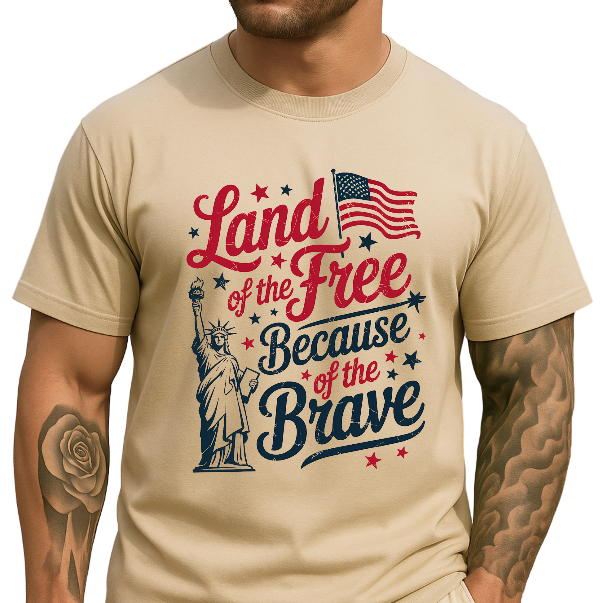 Man wearing a sand-colored t-shirt with patriotic “Land of the Free Because of the Brave” design


