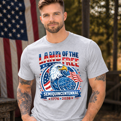 Man wearing a t-shirt with an eagle design and text in front of an American flag.
